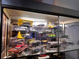 a display case full of toy cars in a store