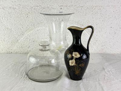 two vases sitting on a table next to each other