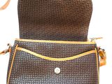 an image of a brown and black purse with a brown strap