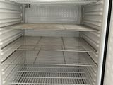 an empty refrigerator with a lot of shelves in it