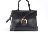 a black leather handbag with a gold buckle on the handle