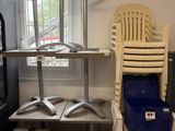 two chairs and a table in a room with a lot of tires