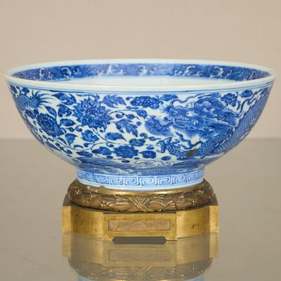 a blue and white bowl sitting on top of a table
