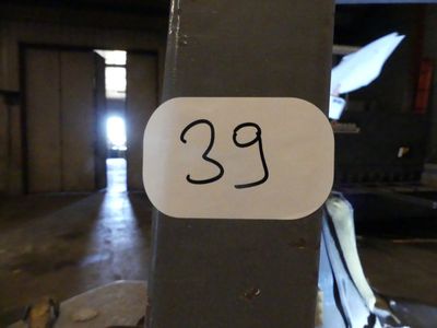a sticker with the number 23 on it on a pole