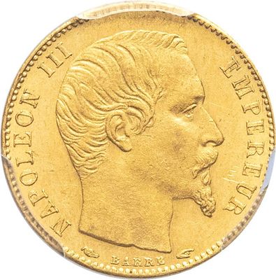 gros plan d'une pièce d'or portant un visage de femme