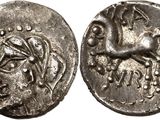 a silver coin with a horse on the front and a horse on the back