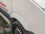 a white van that is parked on the side of the road