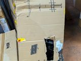 boxes stacked on top of each other on the floor in a store