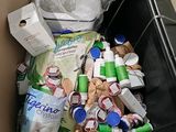 a box full of garbage that is sitting in the floor
