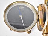a close up of a clock on a wall