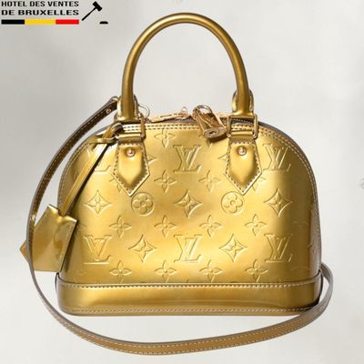 Sac à main Louis Vuitton en cuir doré orné d'étoiles