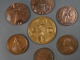 several coins are arranged in a circle on a gray surface
