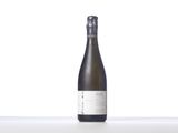 a bottle of wine sitting on top of a white table