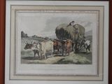 tableau représentant un groupe de vaches et un homme avec une charrette chargée de foin