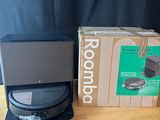 two boxes on a table with a laptop on it