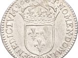 a close up of a coin with a crown on it