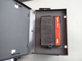 a metal box with a dvd inside of it
