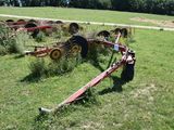 a tractor that is sitting in the middle of a field
