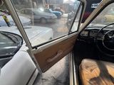 a view of the inside of a car from the driver ' s seat