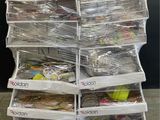 a large stack of plastic containers sitting on a pallet