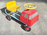 a small toy truck with a steering wheel on the ground