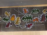 a picture of a sign on a tiled wall