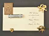 a card with a stamp and a key on it