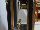 a clock that is sitting on a table in a room