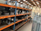 a large amount of pots and pans on shelves in a warehouse
