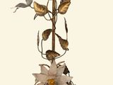 a chandelier with flowers and birds hanging from it
