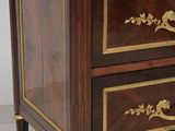 two drawers with marble top on each side of the table