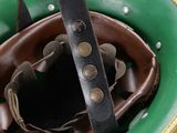 a green and brown helmet with a leather strap on it