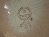 a close up of a plate with a stamp on it