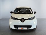 the front of a white car is parked in a showroom