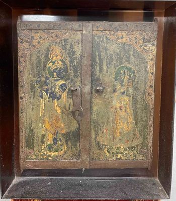 a picture of a wooden cabinet with a painting on it