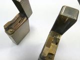 two lighters that are sitting on a table