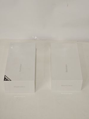 two white boxes that are sitting on a table