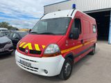 a red and yellow van parked in front of a building