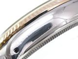 an image of a close up of a watch on a white surface