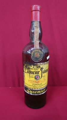 an image of a bottle of liquor sitting on a table