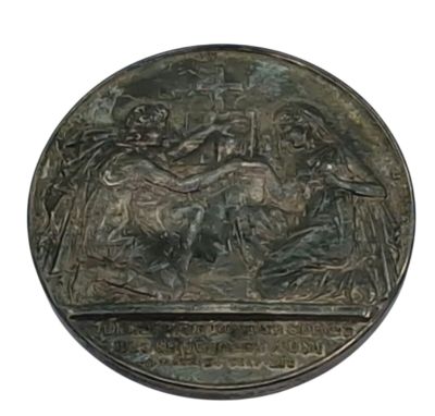 an image of a bronze medal with a picture of a man on a horse and a woman on a horse
