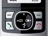 a close up of a cell phone with a clock on the screen