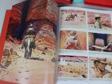 an open book with pictures of a man riding a horse