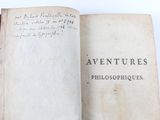 a book with writing on it sitting on a table