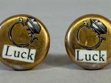 luck and luck cufflinks with the word luck written on them