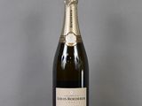 an image of a bottle of champagne on a table