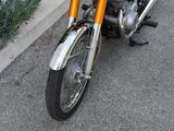 a motorcycle that is parked on the side of the street