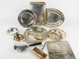 a lot of silver items that are on the table