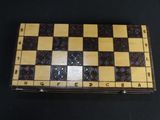 wooden chess board with black and white squares and numbers on it