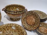 many bowls and plates that are sitting on a table